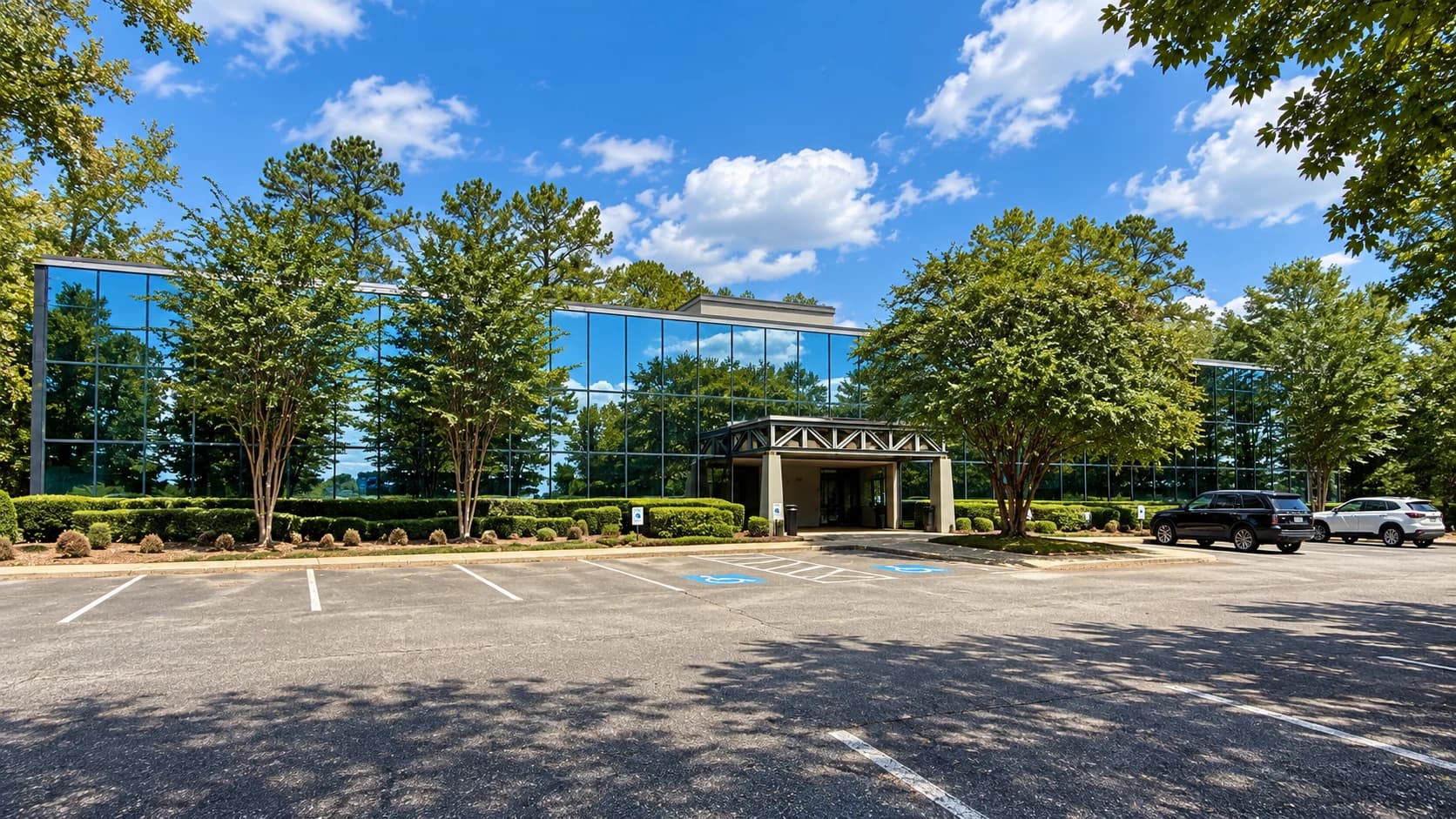 The glass-fronted Progressive headquarters building and covered entrance in Macon, Georgia